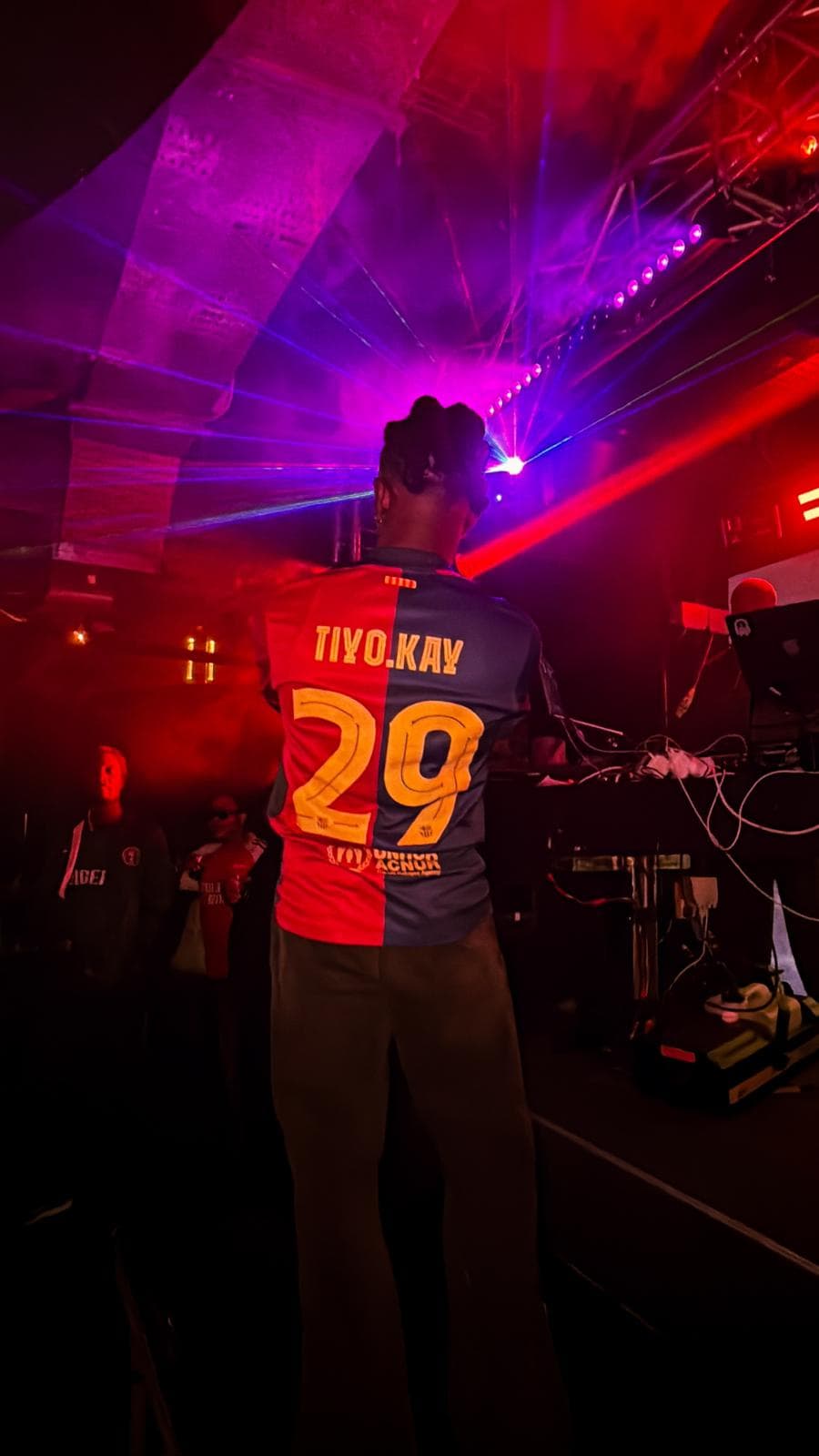 Tiyo Kay jersey from behind on stage