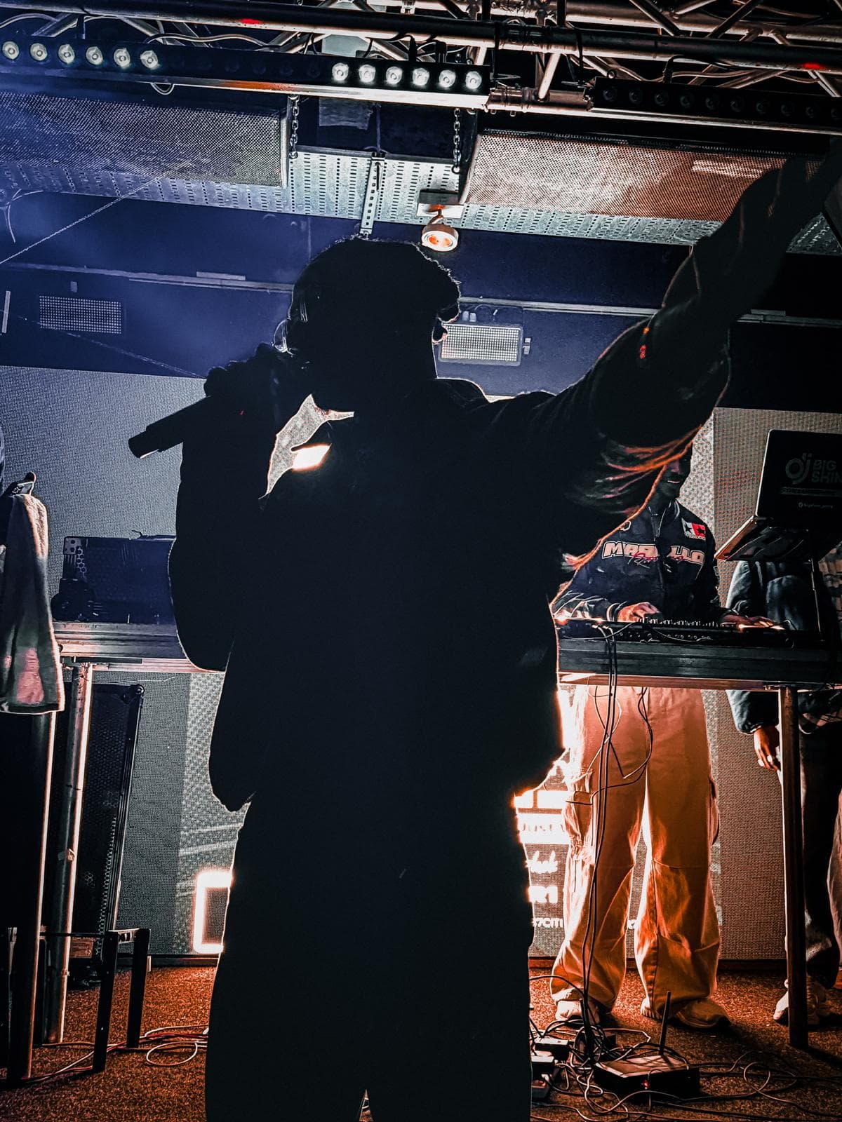 Tiyo Kay silhouette on stage