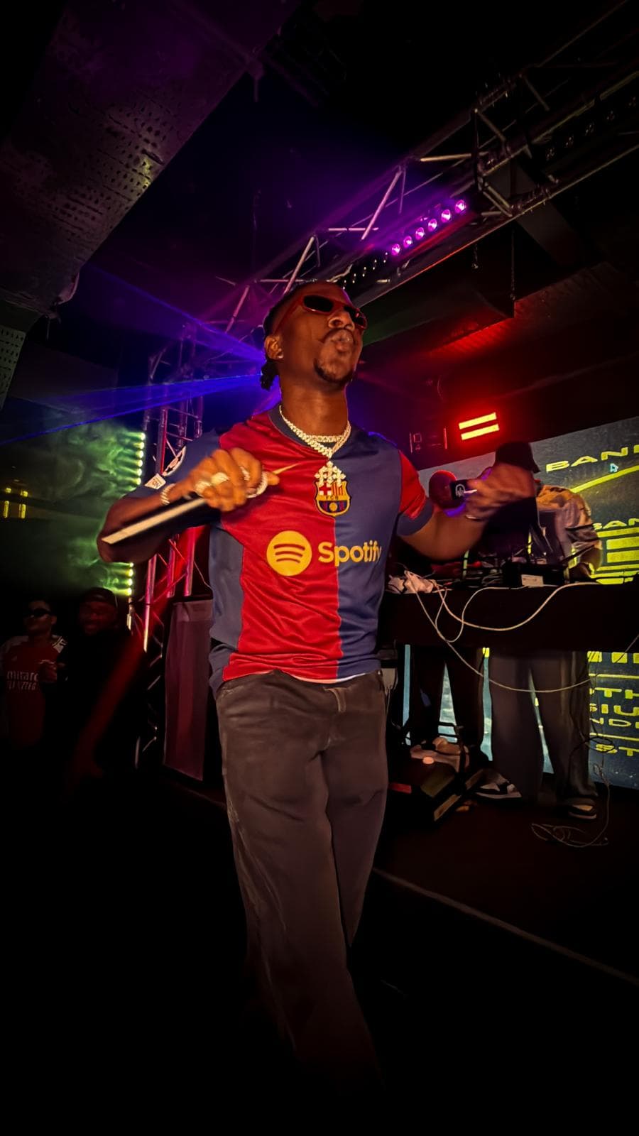 Tiyo Kay on stage with mic