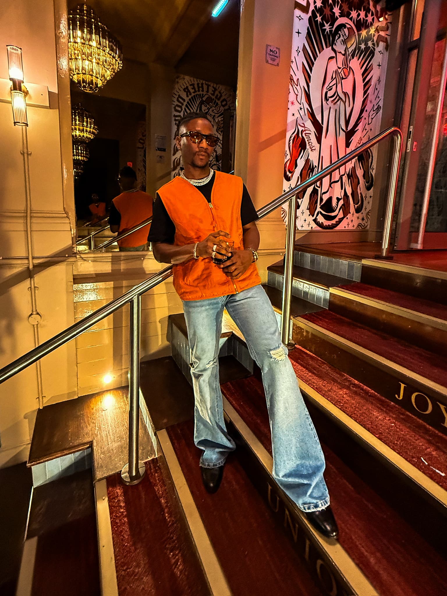 Tiyo Kay portrait on a staircase